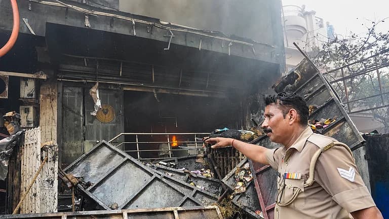 Rescue operations at the Lucknow coaching centre stalled; a wall had to be broken down to retrieve the bodies