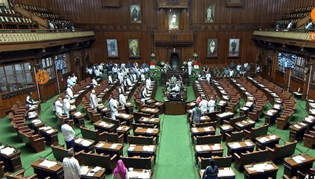 K'taka Council ruling party members complain over disruption of proceedings due to Oppn protests; seek action