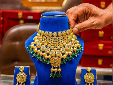 Gold prices drop marginally as investors await US Fed Chair remarks (Lead)